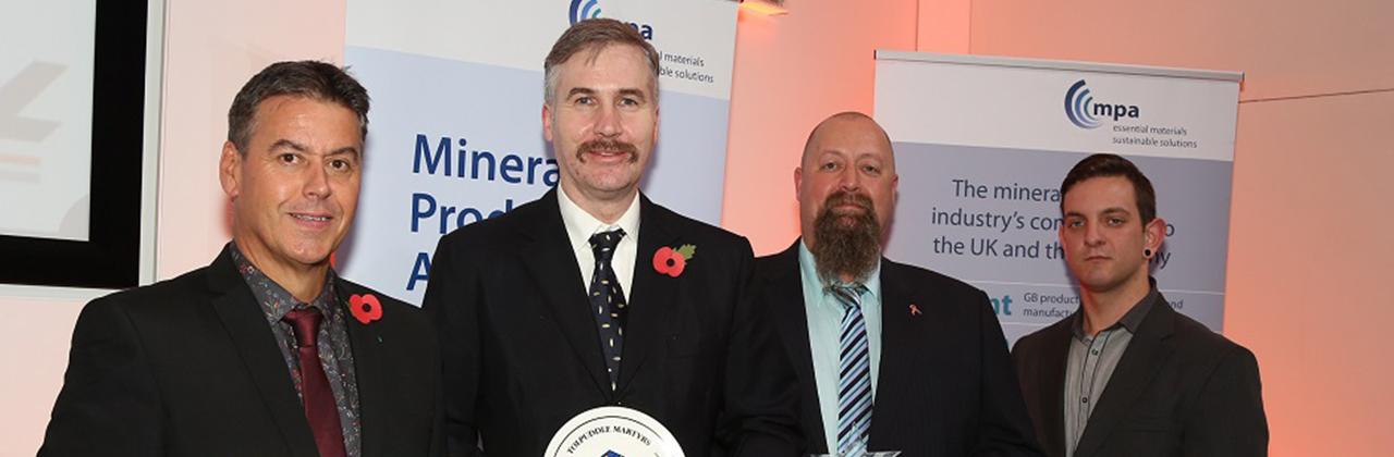 Pictured with the TUC Trophy for worker involvement are, from left, Needingworth unit manager Hilton Law, weighbridge operator Simon Downing, general foreman Ian Ballard and plant operator Chris Ivatt. 