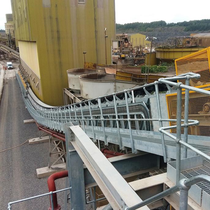 Whatley quarry. A 70-metre conveyor transfers up to 150 tonnes of washed aggregates an hour into four specially-built reinforced 15-metre by 12-metre concrete bays ready for onward delivery to Hinkley Point.